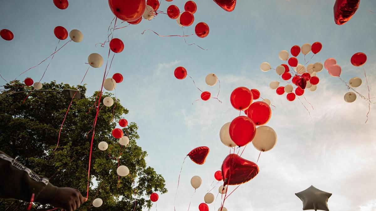 Balloons are released during a Sept. 13, 2022 vigil for Elizabeth Level who died after being caught in the crossfire of a shootout in front of her Liberty City home in Miami, Florida on Sept. 9, 2022.