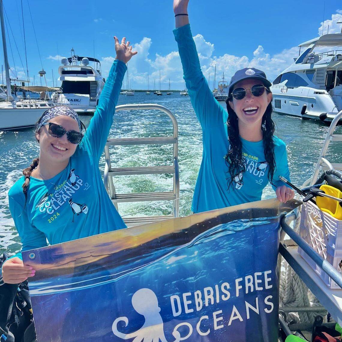 Amanda Di Perna, program manager at Debris Free Oceans, left, and Maddie Kaufman, program director, celebrate after a cleanup. Working with Divers Paradise and University of Miami Rescue a Reef, Debris Free Oceans removed 165 pounds of debris around two coral reefs.