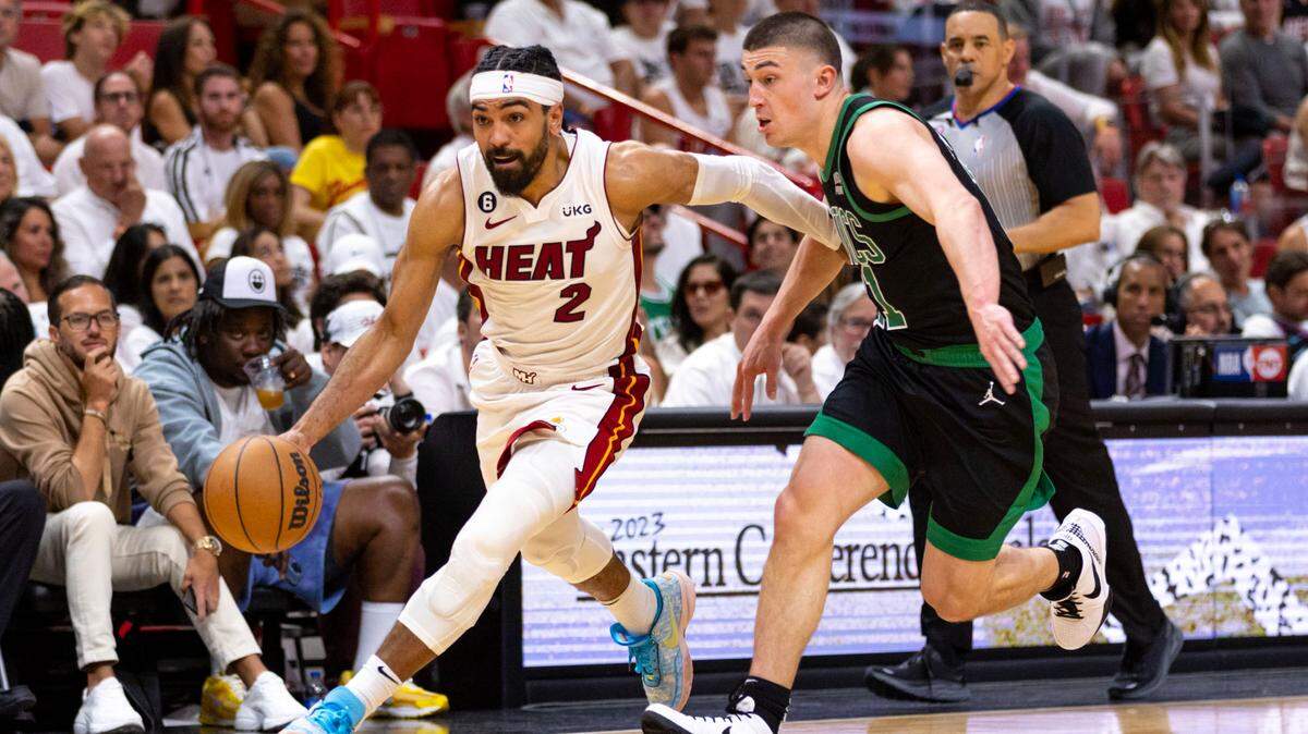 Miami Heat point guard Gabe Vincent (2) drives past Boston Celtics point guard Payton Pritchard (11) during the second half of Game 3 of the NBA Eastern Conference Finals series at Kaseya Center in Miami, Florida, on May 21, 2023.