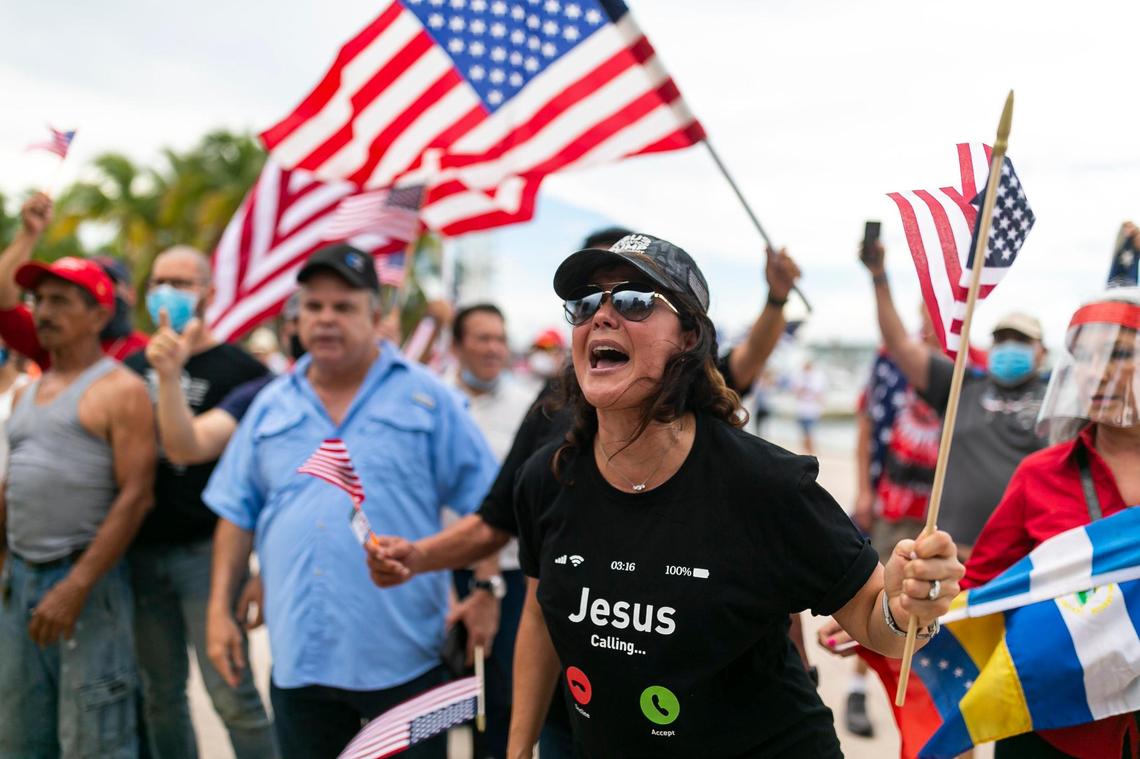 Beatrice Viera, 50, an activist with the Law and Order rally yells toward an anti-police brutality protest that confronted her group near the Pepper Fountain at Bayfront Park on Sunday, June 14, 2020.