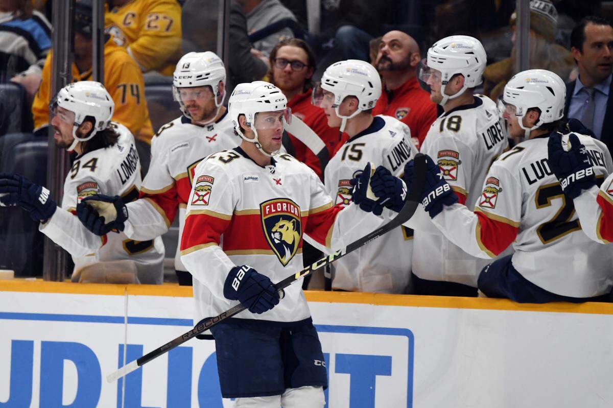 Jan 22, 2024; Nashville, Tennessee, USA; Florida Panthers center Carter Verhaeghe (23) is congratulated by teammates after a goal during the third period against the Nashville Predators at Bridgestone Arena.