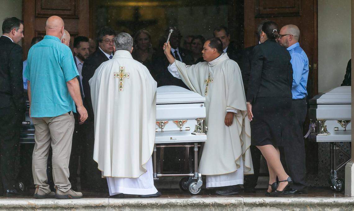 Father Elvis Gonzalez blesses the casket of Anaely Rodriguez at the funeral Mass at St. Joseph Catholic Church in Miami Beach, Florida, on Tuesday, July 6, 2021. Rodriguez, her husband, Marcus Guara, and their daughters, Lucia, 10, and Emma, 4, died during the Champlain Towers South condo collapse that happened on Thursday, June 24, 2021.
