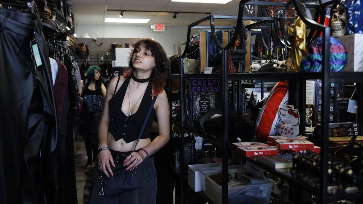Reign Vonacossa shops at Freak House, an alternative clothing store, on Thursday, June 18, 2026, on S Dixie Hwy in Miami, Fla. Freak House, owned and operated by James and Ana Jones, is closing its doors next Friday. “It's closing? I've shopped here a couple times,” said Vonacossa.