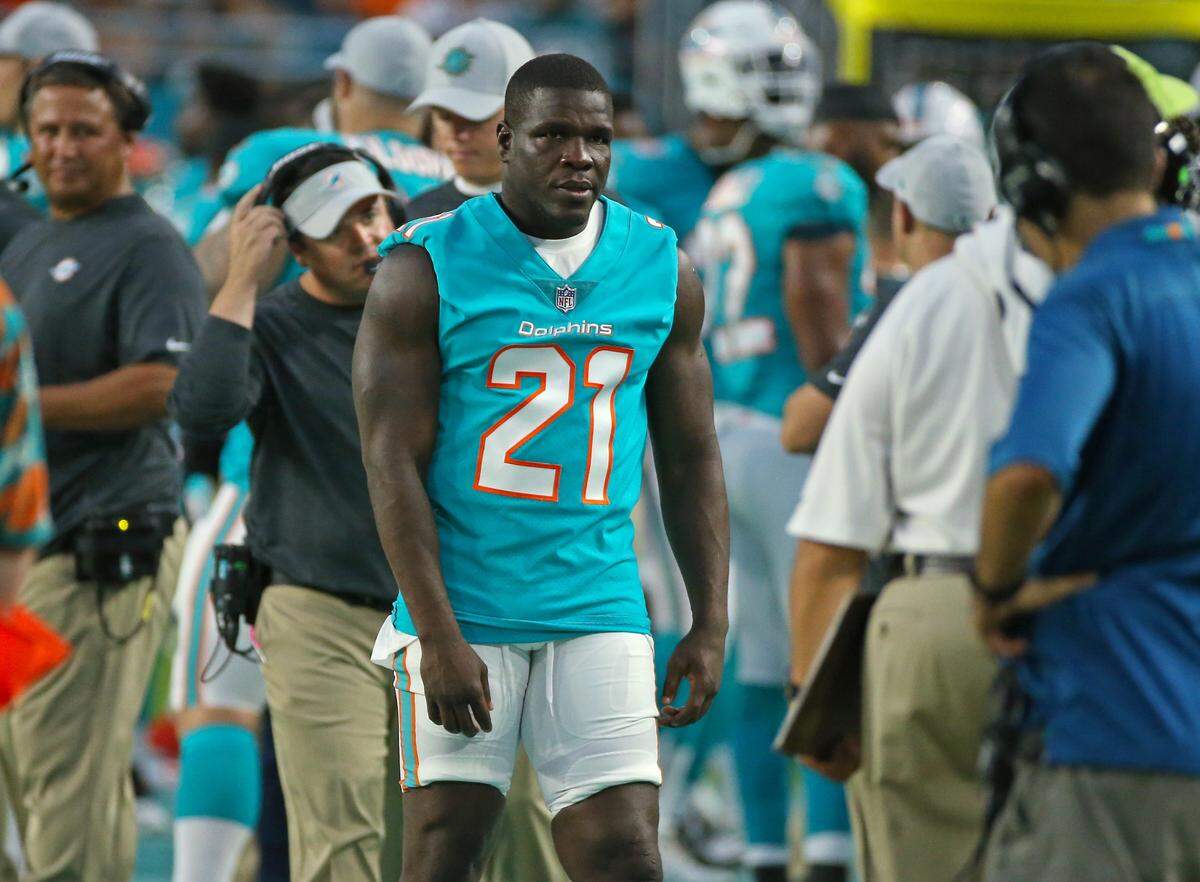 Miami Dolphins running back Frank Gore #21 looks on  during second quarter of an NFL football game against the Tampa Bay Buccaneers at Hard Rock Stadium on Thursday, August. 9, 2018, in Miami Gardens.
