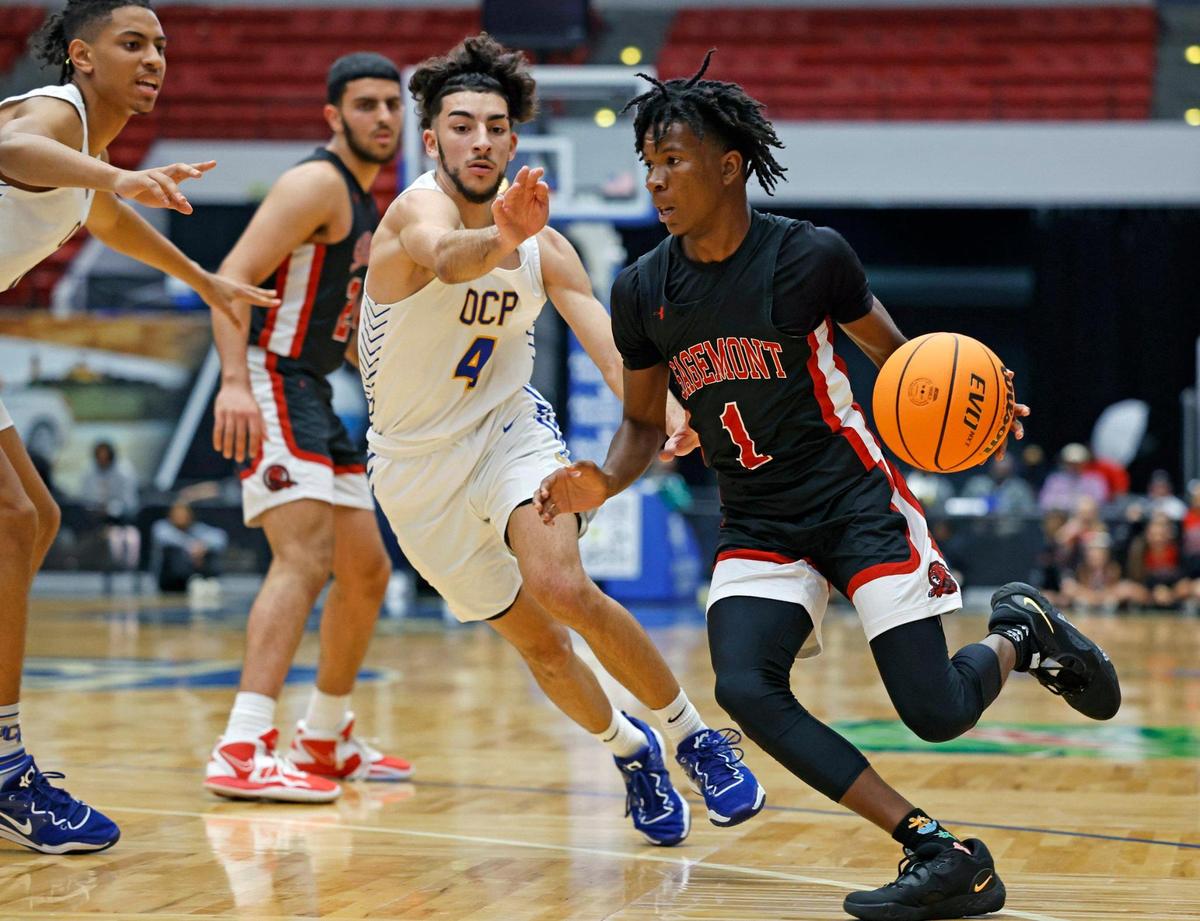 Sagemont High School’s Ashton Smith (1) drives the ball as Orlando Christian Prep’s Ameer Ramadan (4) gives chase in the first half of the game during the FHSAA Class 2A Final at the RP Funding Center in Lakeland, Florida on Friday, March 3, 2023.