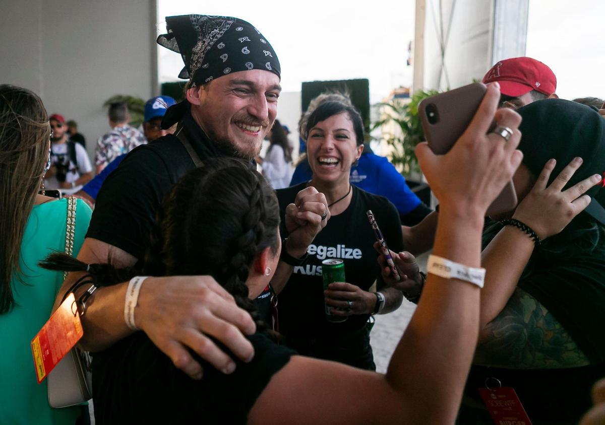 Kush Chef Leo Osorio celebrates with his staff after winning the Heineken People’s Choice Award at the South Beach Wine & Food Festival’s Burger Bash in Miami Beach, Florida on Thursday, May 20, 2021.