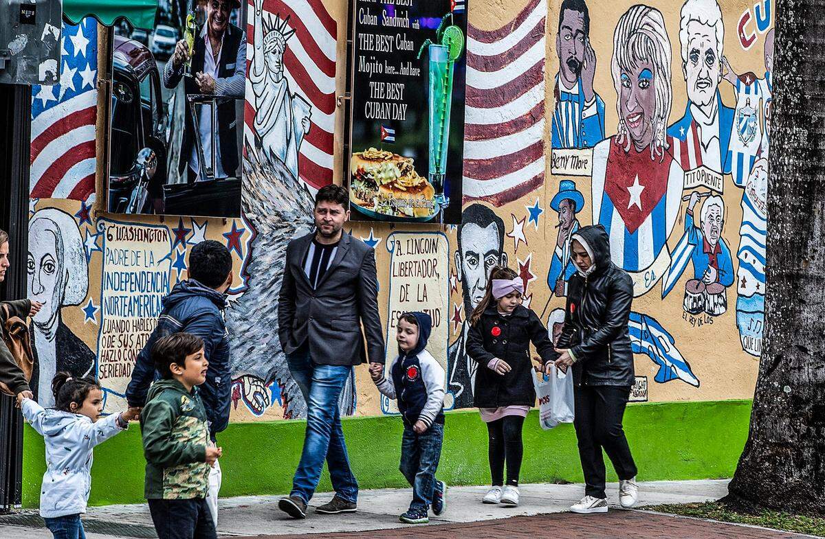 The cold temperatures in Miami on Christmas Day didn’t stop people from gathering along Calle Ocho in Little Havana on Sunday, Dec. 25, 2022.