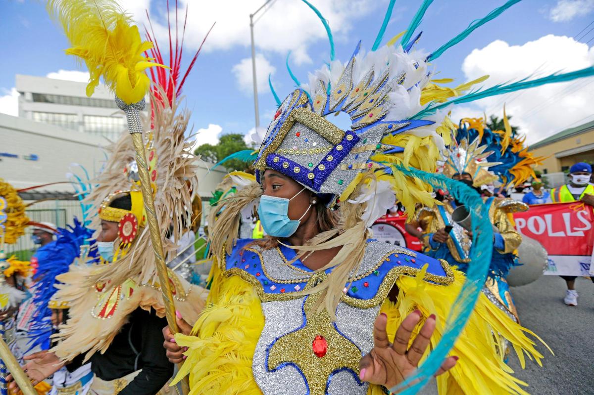 Bahamian Junkanoo perform as people marching during the Souls to the Polls in the last day of early voting as part of one of many events prior to the general elections outside the Joseph Caleb Center on Sunday, November 1, 2020, in Miami. March begins at 1:00 pm from the African Heritage Cultural Arts Center 6161 NW 22nd Ave., Miami, FL 33142 Voters will March to the Joseph Caleb Center 5400 N.W. 22nd Ave., Miami, FL 33142 for a Rally and to VOTE!