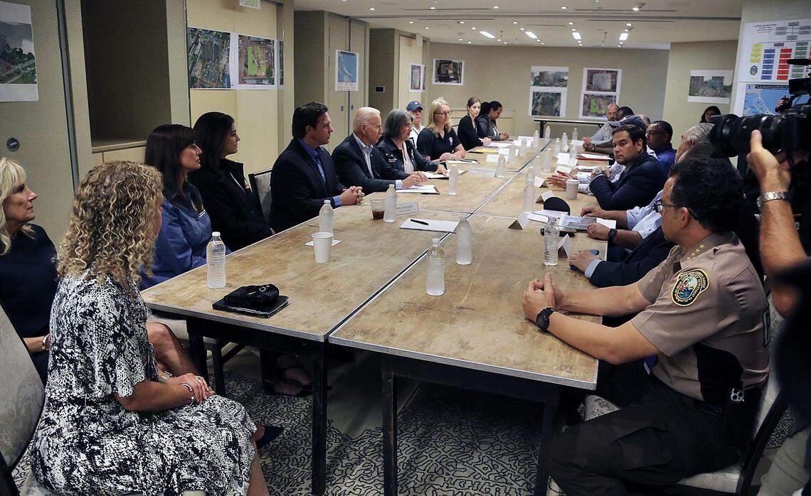 Burkett (left, wearing baseball cap) attends a meeting with President Joe Biden at the St. Regis Hotel on July 1, 2021.
