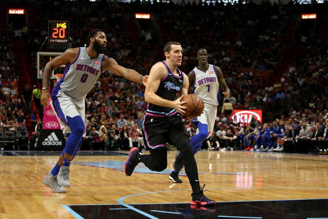 Miami Heat guard Goran Dragic (7) drives to the basket Detroit Pistons center Andre Drummond (0) in the first quarter of an NBA basketball game at AmericanAirlines Arena on Saturday, February 23, 2019 in Miami.