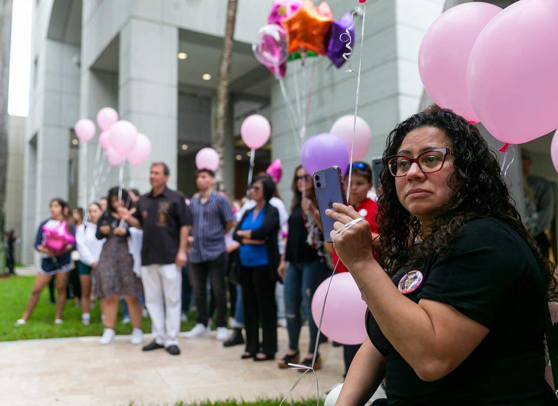 Family and friends attend the unveiling of a memorial at Florida International University in Miami, Florida on the fourth anniversary of the FIU bridge collapse on Tuesday, March 15, 2022. The bronze statue, which was made by Brian Hanlon, commemorates former FIU student Alexa Duran and the other five victims who were killed when a pedestrian bridge, still underway, collapsed on March 15, 2018.