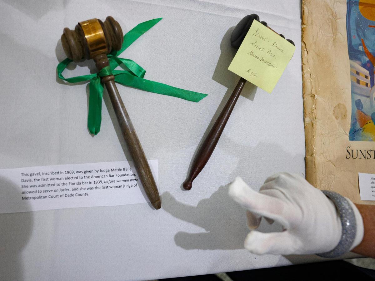Mayor Daniella Levine Cava points to a gavel that was in the time capsule from Judge Mattie Belle Davis, the first woman in Florida and the second woman nationally to be elected to the American Bar Foundation, during the unveiling of its contents on Wednesday, March 22, 2023, at Women’s Park in Miami. The time capsule was buried in 1992 and was supposed to be dug up on the 100th anniversary of women’s suffrage but got delayed due to COVID-19.