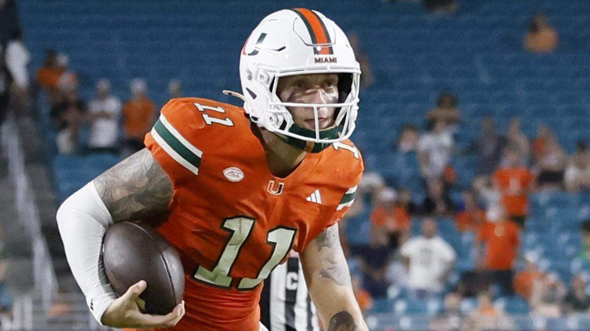 Miami Hurricanes quarterback Carson Beck (11) runs to the goalline during the game against the South Florida Bulls in the second half of their NCAA football game at Hard Rock Stadium in Miami Gardens, Florida, on Saturday, September 13, 2025.