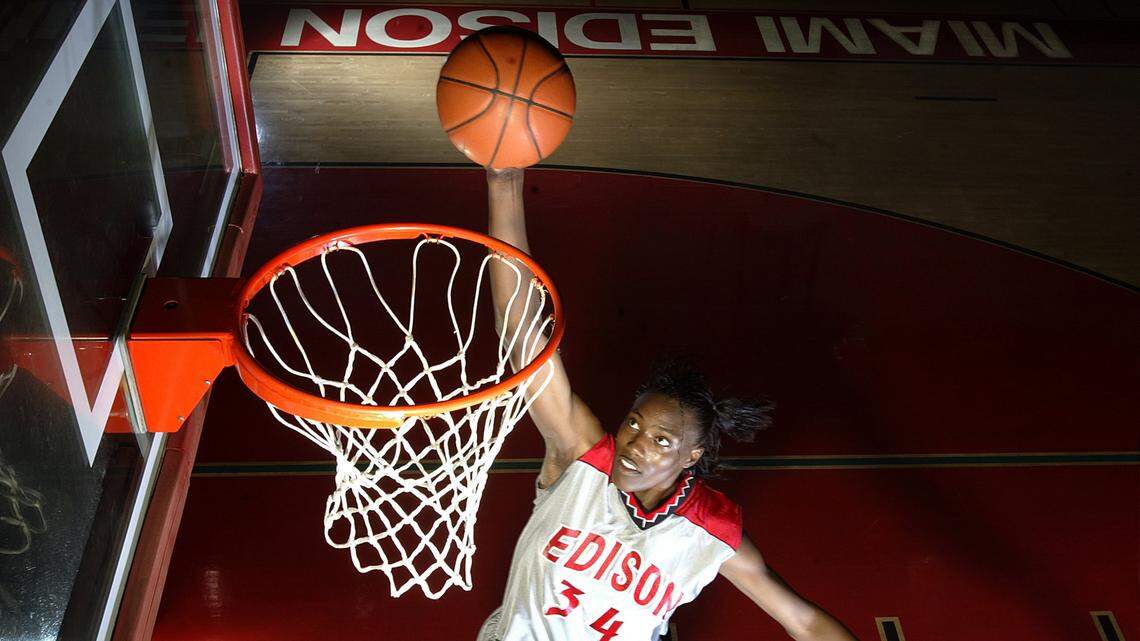 Friday 02/28/03 - Richard Patterson/Herald Staff - Sylvia Fowles, of Miami Edison High School, practices her dunking skills during the last practice before their regional playoff game. She is 6-5 and the first high school girl in the country EVER to dunk. Her team has won two state titles in a row. Sylvia is also one of the most highly recruited players in the country.