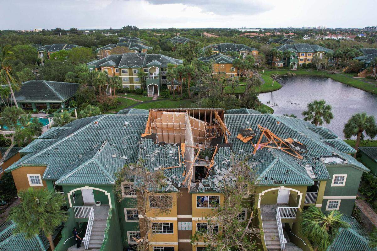 A building at the Sanctuary Cove Apartment complex suffered heavy damage to the roof and windows in the aftermath of a Saturday evening tornado, seen on Sunday, April 30, 2023, in Palm Beach Gardens, Fla. The National Weather Service confirmed an EF-1 tornado touched down in Palm Beach Gardens Saturday evening.
