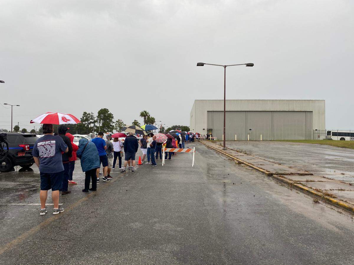 President Donald Trump supporters line up outside the Tallahassee International Airport to attend a rally hosted by Vice President Mike Pence on Saturday, Oct. 24, 2020.