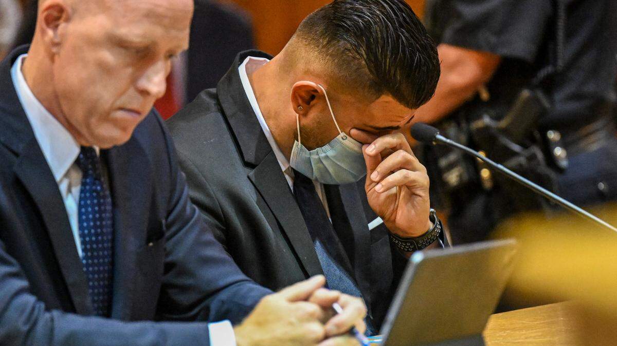Lee Kindlon, attorney for Nauman Hussain, left, and Nauman Hussain, who ran the limo company involved in the 2018 crash in Schoharie that killed 20 people, listens to a victim impact statement during a proceeding in Schoharie County court on Wednesday, Aug. 31, 2021, in Schoharie, N.Y.
