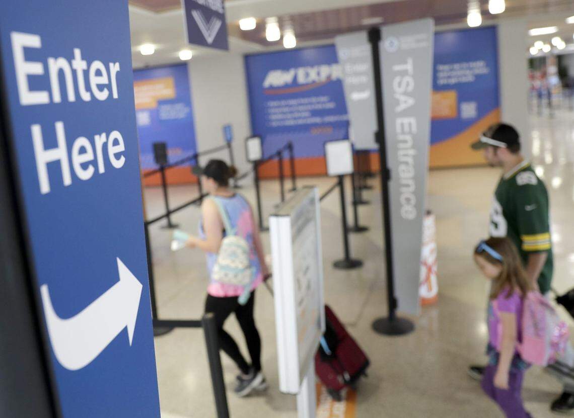 A family is seen entering TSA at Appleton International Airport in 2022, in Greenville.