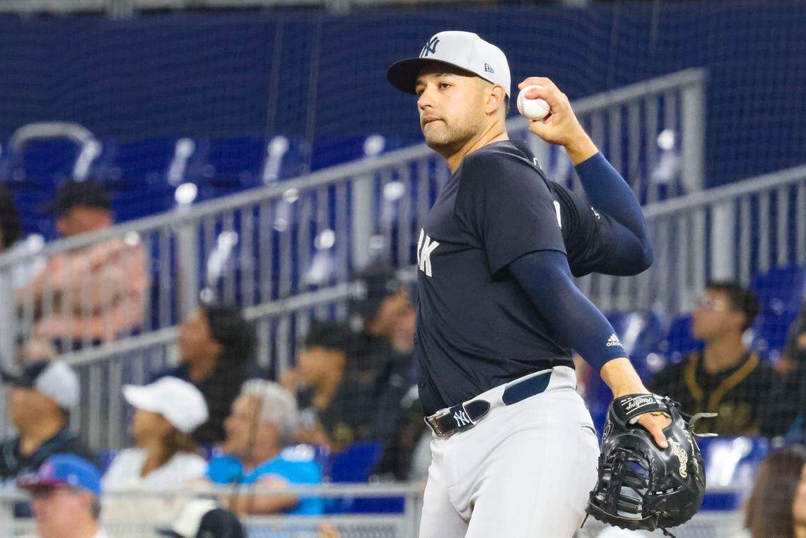 New York Yankees catcher J.C. Escarra (79) throws the ball around the infield during the eighth inning of an exhibition game against the Miami Marlins on Tuesday, March 25, 2025, at loanDepot Park in Miami, Fla. The Marlins won 4-2.