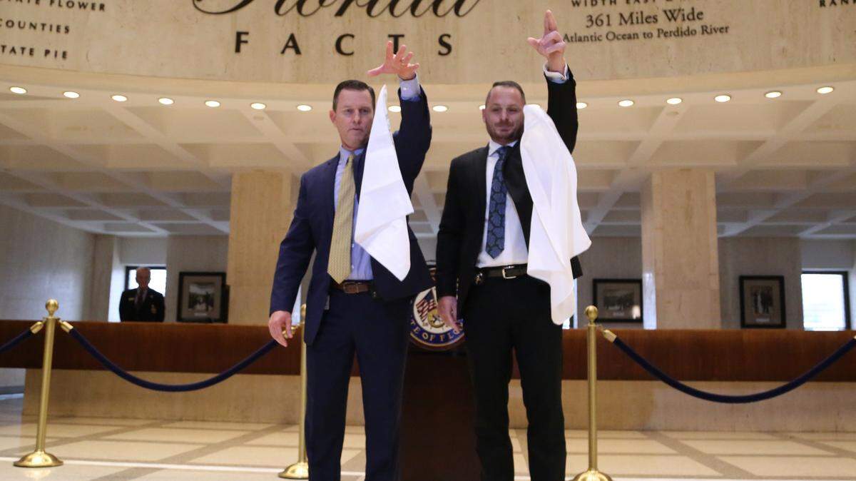 Sergeant at Arms for the House, Russell Hosford, and Tim Hay for the Senate, drop handkerchiefs during the “sine die” ceremony in 2019, meaning the Florida Legislature’s session has adjourned