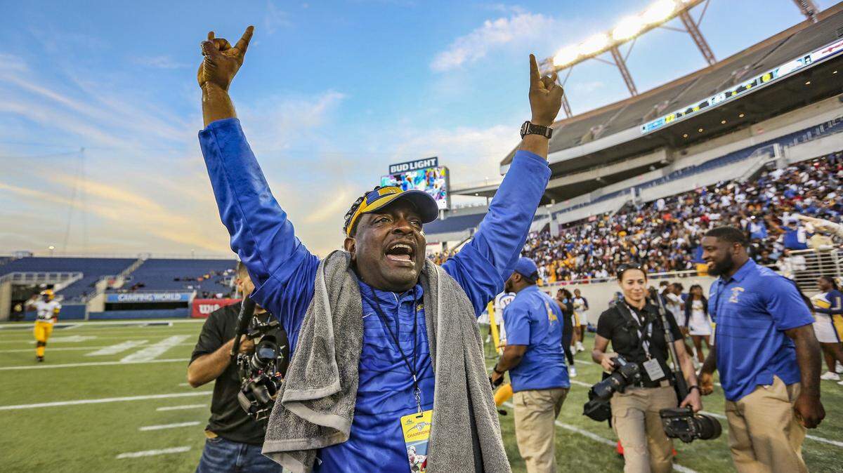 The Bulls head coach Max Edwards celebrates after Miami Northwestern defeats Armwood Hawks during the Florida High School Athletic Association State Championship Class 6A Saturday, Dec. 8, 2018, at Camping World Stadium in Orlando.