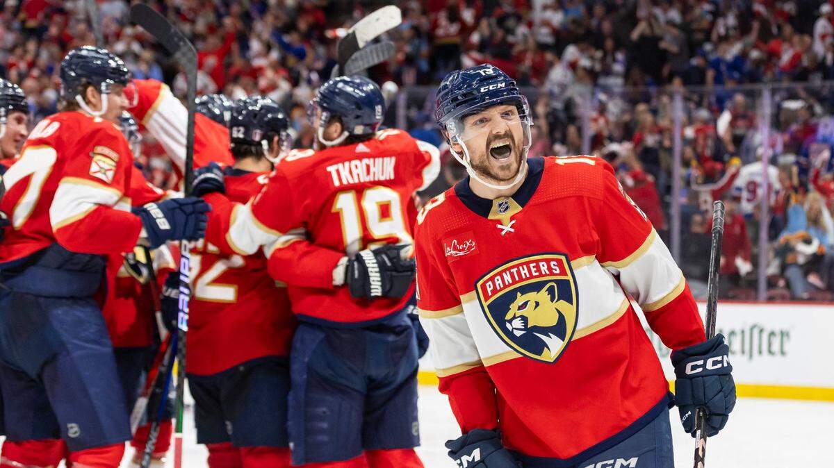 Florida Panthers center Sam Reinhart (13) celebrates after scoring the game-winning goal against the New York Rangers in an overtime period of Game 4 during the Eastern Conference finals of the NHL hockey Stanley Cup playoffs at the Amerant Bank Arena on Tuesday, May 28, 2024, in Sunrise, Fla.