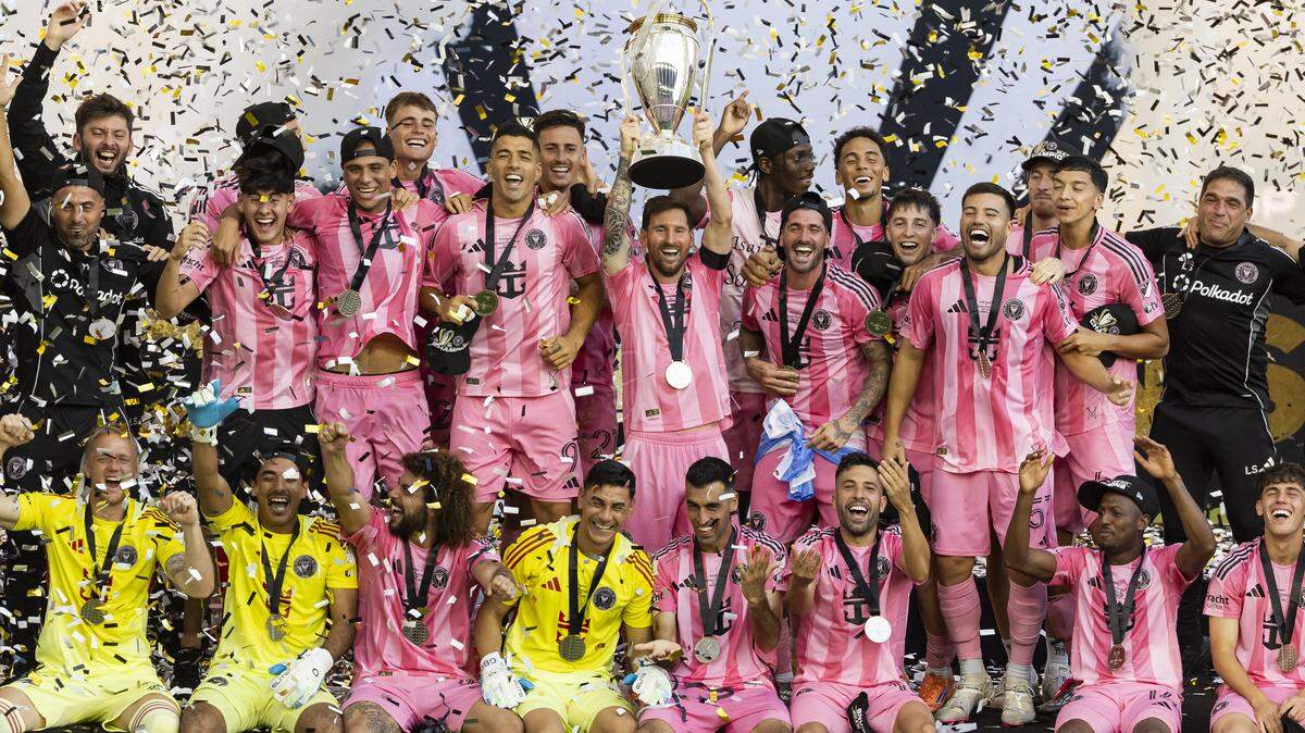 Inter Miami forward Lionel Messi (10) lifts the Philip F. Anschutz Trophy alongside his teammates after they defeated Vancouver Whitecaps in their MLS Cup final match at Chase Stadium on Saturday, Dec. 6, 2025, in Fort Lauderdale, Fla.