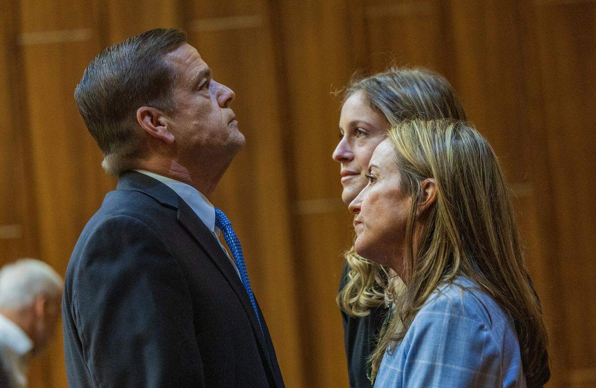 Defendant George Pino shares with his daughter Carolina Pino (far back) and his wife, Cecilia Pino, during a motion hearing, as he is facing vessel homicide charges related to the 2022 boat crash that killed an Our Lady of Lourdes Academy student, in front of Judge Marisa Tinkler Mendez at Courtroom 4-6 in the Richard E. Gerstein Justice Building, on Wednesday, May 27, 2026.