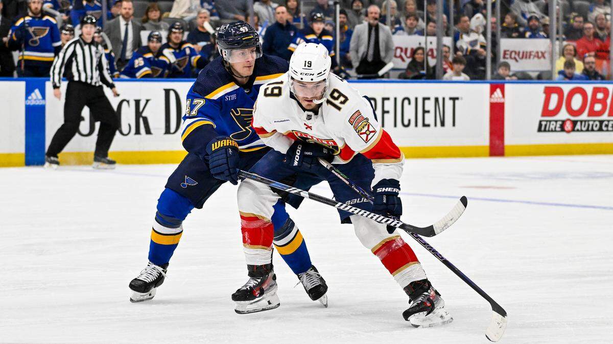 Jan 9, 2024; St. Louis, Missouri, USA; Florida Panthers left wing Matthew Tkachuk (19) controls the puck as St. Louis Blues defenseman Torey Krug (47) defends during the first period at Enterprise Center.