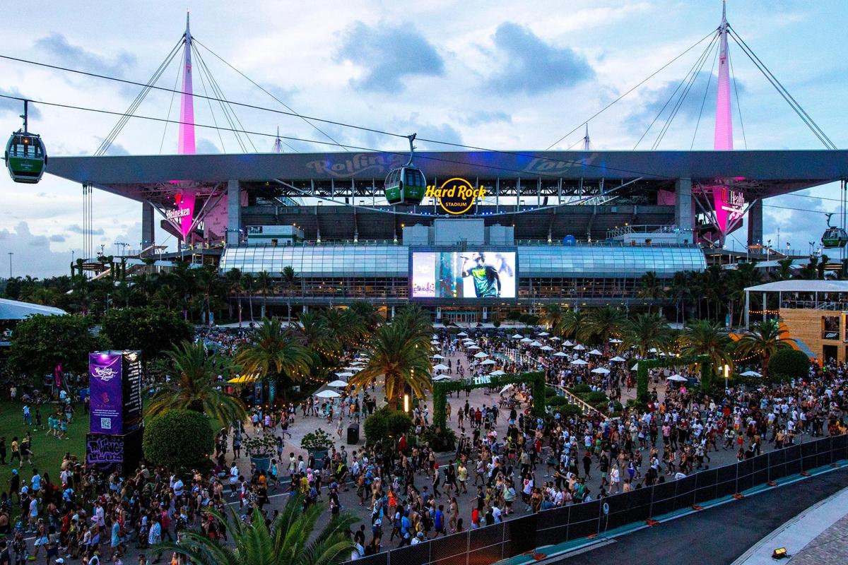Festival goers walk the grounds during the first day of Rolling Loud Miami, an international hip-hop festival, at Hard Rock Stadium in Miami Gardens, Florida, on Friday, July 22, 2022.