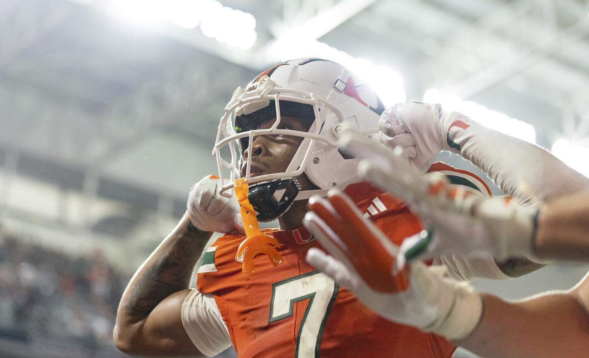Miami Hurricanes wide receiver CJ Daniels (7) celebrates after catching a touchdown pass against Bethune-Cookman Wildcats in the first half of their NCAA football game at Hard Rock Stadium on Saturday, Sept. 6, 2025, in Miami Gardens, Fla.