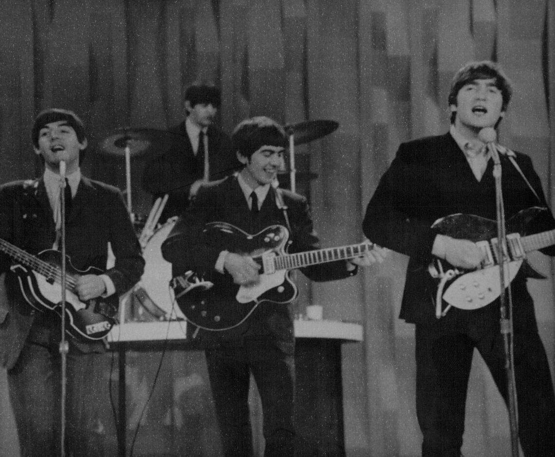 The Beatles perform for the first time on American television on “The Ed Sullivan Show” in 1964.