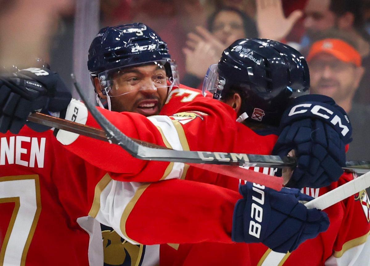Florida Panthers defenseman Seth Jones (3) gets a group hug after scoring a goal during the third period of Game 4 of the first-round Stanley Cup playoff series against the Tampa Bay Lightning on Monday, April 28, 2025, at Amerant Bank Arena in Sunrise, Fla. The Panthers won 4-2.