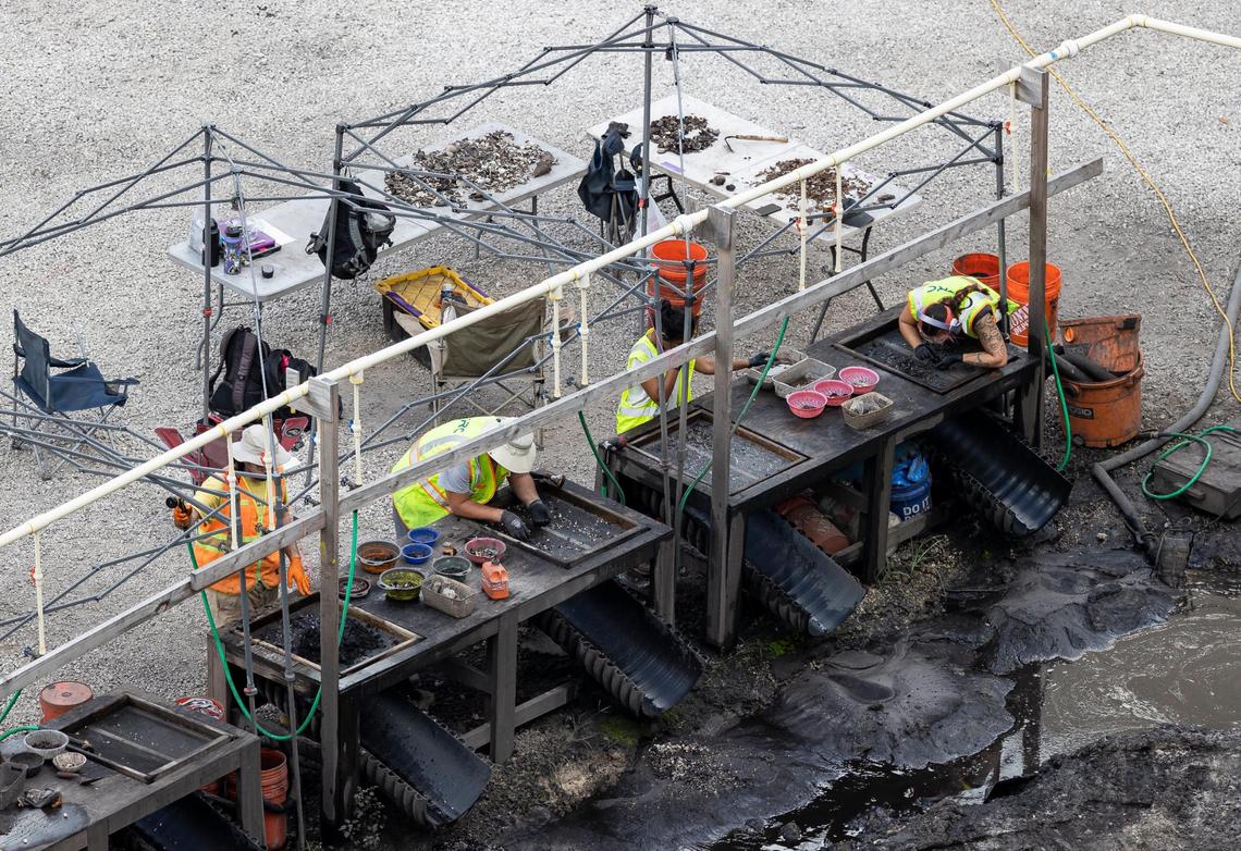 Members of an archaeological team sift through soil excavated from the site of a planned Related Group residential tower complex in Brickell. The team has unearthed extensive evidence of occupation by prehistoric indigenous people and artifacts dating back 7,000 years.
