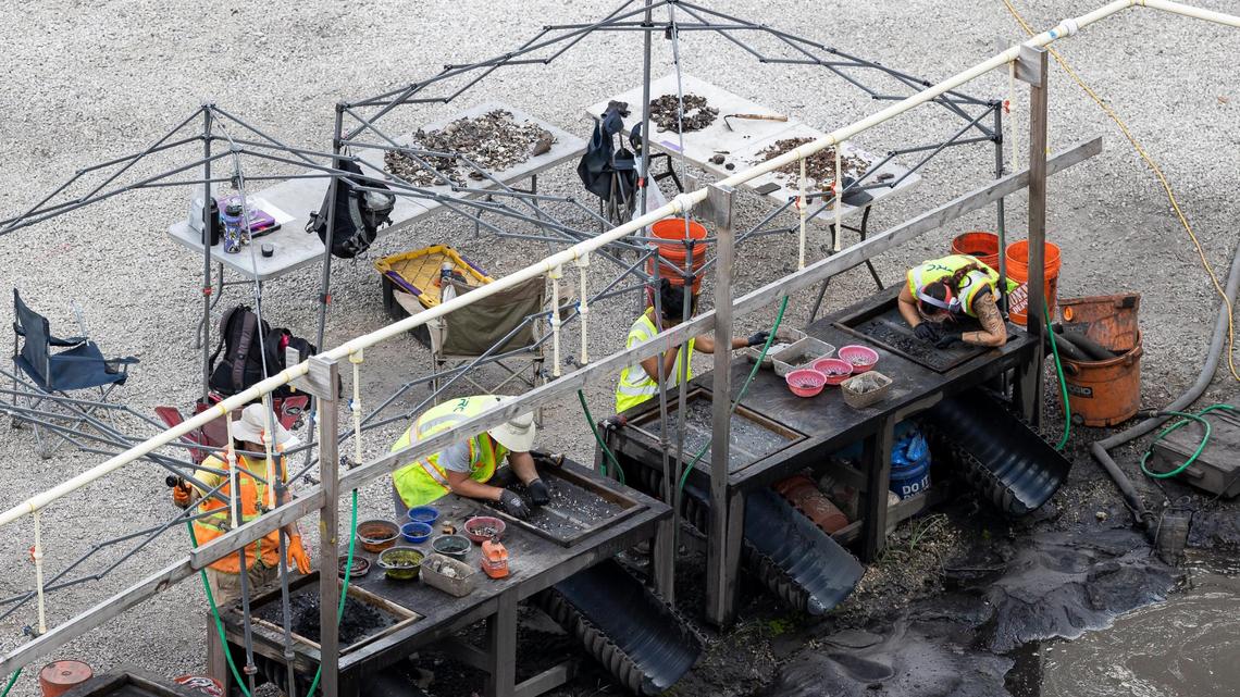 An archaeological team sifts through soil excavated from the site of a planned Related Group residential tower complex in Brickell.