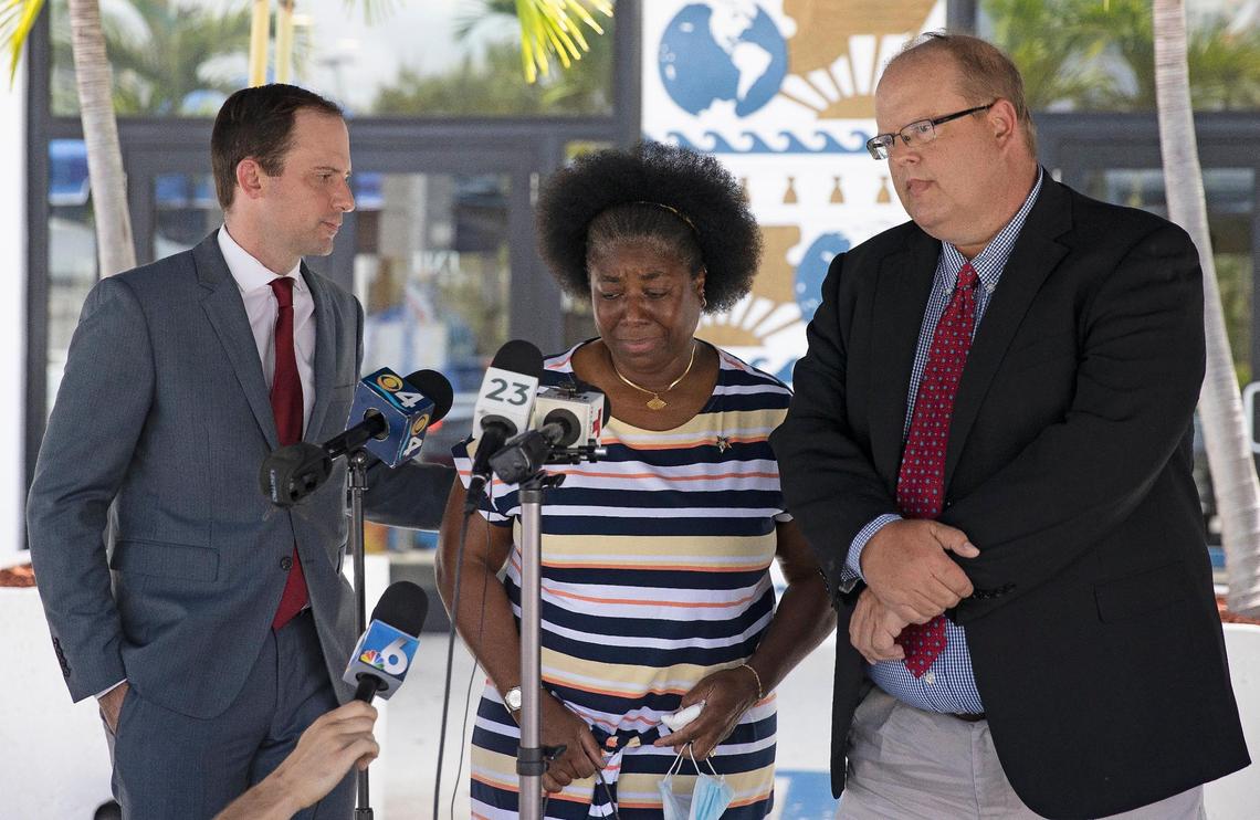 From left to right: Attorney Matthew Baldwin, Miami code inspector Suzann Nicholson and attorney David Winker speak on a defamation lawsuit they filed against Commissioner Alex Diaz de la Portitlla outside the City of Miami City Hall on Thursday, April 29, 2021 in Miami, Fl. They accuse the commissioner of libel after he accused her of fabricating a physical altercation with him in order to claim workers compensation.