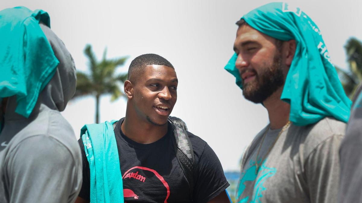 Channing Tindall, left, talks to Skylar Thompson, signed members of the Miami Dolphins rookie class, during a historic walking tour of Downtown Miami with local community groups on Wednesday, June 15, 2022 beginning with tour leaders at the History Miami Museum. Tindall and Thompson are two of the four players of the rookie class actually singed to the roster for this coming season.