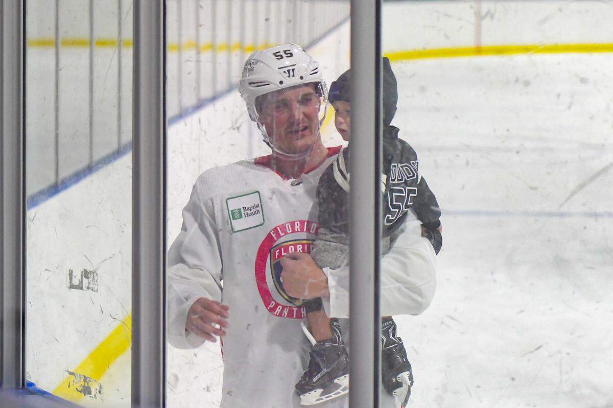Florida Panthers forward Noel Acciari holds his 19-month-old son, Greyson, after practice on Sunday, Feb. 13, 2022, at the Panthers IceDen in Coral Springs, Florida.