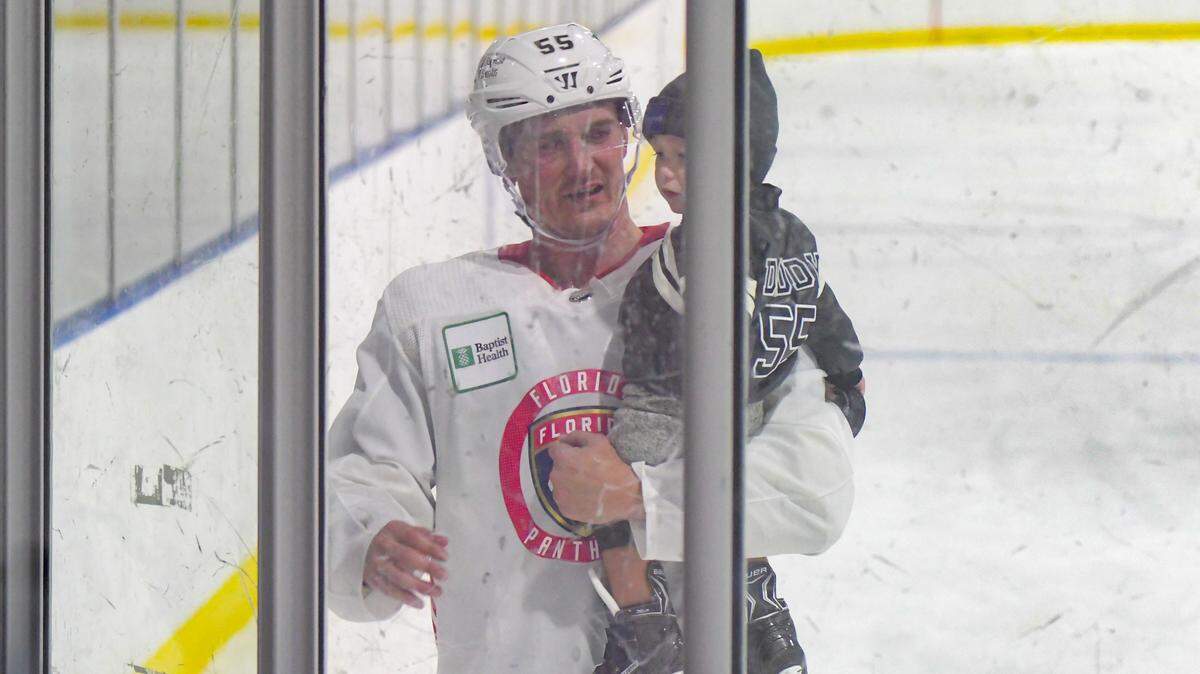 Florida Panthers forward Noel Acciari holds his 19-month-old son, Greyson, after practice on Sunday, Feb. 13, 2022, at the Panthers IceDen in Coral Springs, Florida.