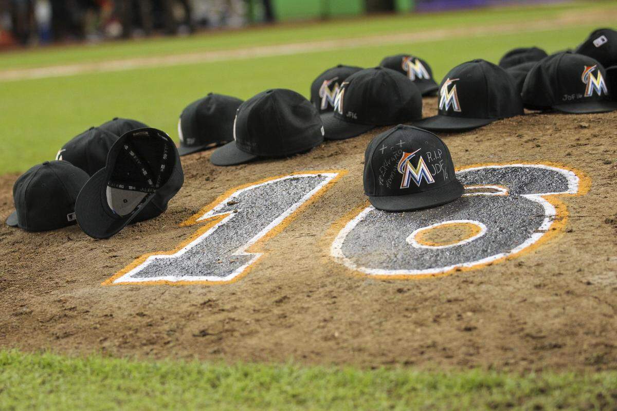The Miami Marlins left their caps at the pitching mound in tribute to Jose Fernandez after the end of their baseball game against the New York Mets on Monday, Sept. 26, 2016. The mound bore his jersey number, 16.