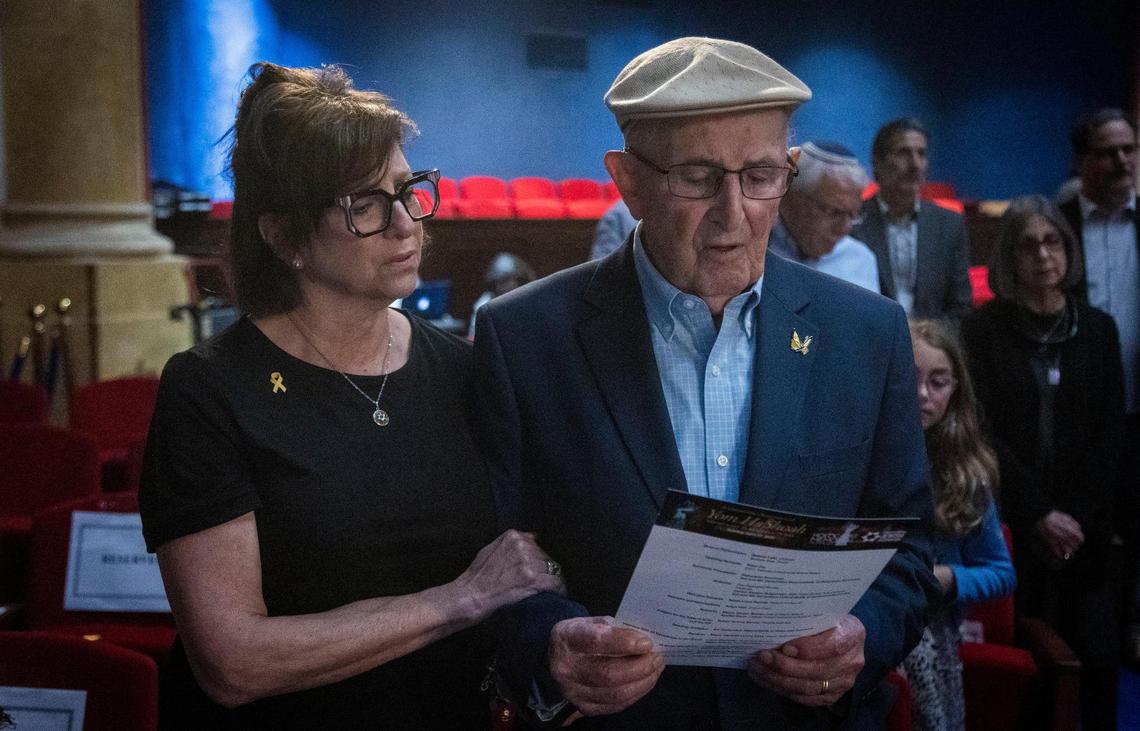 Miami Beach, FL, April 27, 2025 - Holocaust survivor, Larry Gochman, right, sings The Hymn of the Partisans along with his daughter, Rochelle Sroka during a ceremony to Commemorate Yom HaShoah, Holocaust Remembrance Day at Temple Emanu-El in Miami Beach 1701 Washington Avenue, Miami Beach, FL