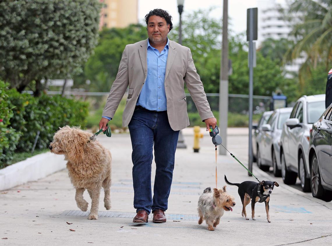 Ariel Jaimes owns three dogs, a large goldendoodle, a Chihuahua and a Yorkie, and has had difficulty finding places to walk them during the coronavirus pandemic while parks have been closed. He and other pet owners are relieved that dog parks will reopen Monday.