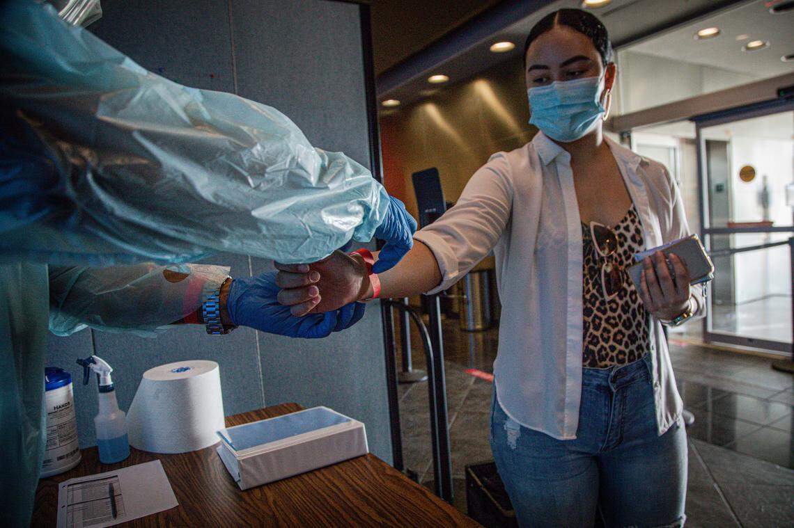 Miami Dade College students and staff get the temperature checked when they arrive to the Wolfson Campus check point on June 23, 2020.