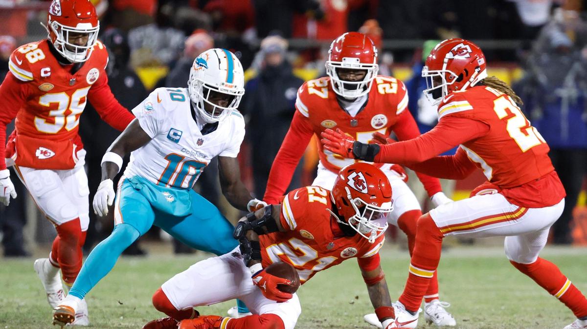 Kansas City Chiefs safety Mike Edwards (21) intercepted a pass intended to Miami Dolphins wide receiver Tyreek Hill (10) during first half of an NFL wild-card playoff football game at GEHA Field at Arrowhead Stadium in Kansas City, Missouri, on Saturday, January 13, 2024.