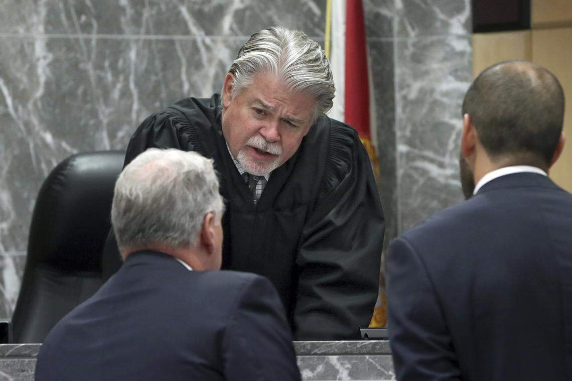 Broward Circuit Judge Dennis Bailey speaks to an attorney in a sidebar discussion during a trial at the Broward County Courthouse in Fort Lauderdale on Wednesday, May 22, 2019. Bailey was reprimanded for his actions during a 2018 trial.
