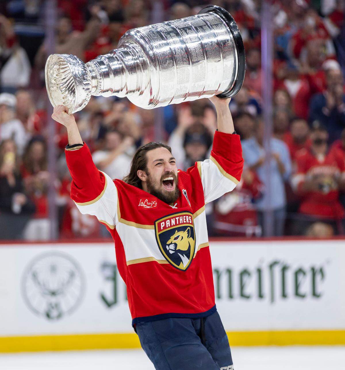 Florida Panthers left wing Ryan Lomberg (94) lifts the Stanley Cup after defeating the Edmonton Oilers in Game 7 of the Stanley Cup Final at Amerant Bank Arena on Monday, June 24, 2024, in Sunrise, Fla.