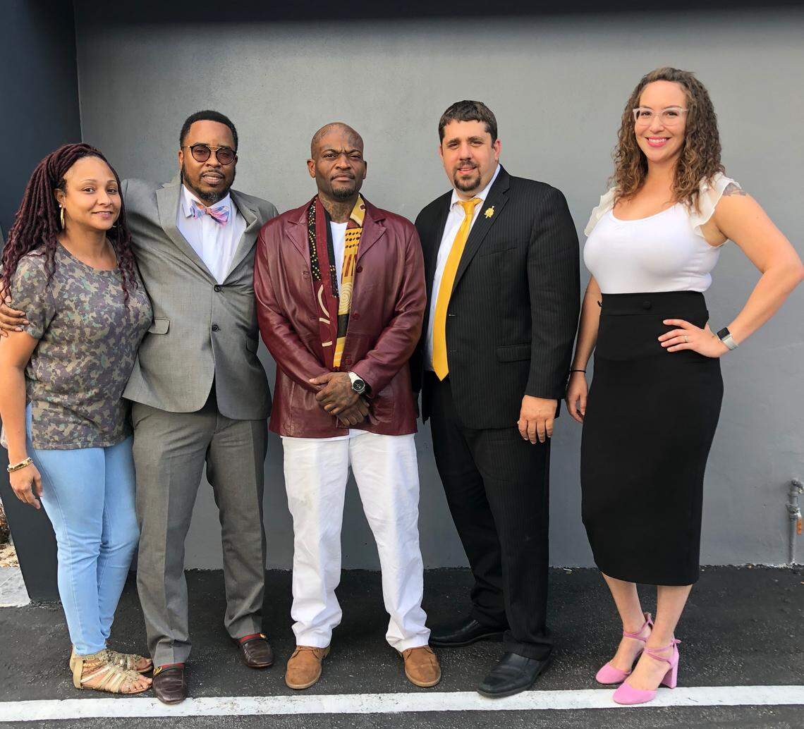 Christopher Nealy, center, with his legal team after a jury awarded him $8.7 million in damages stemming from gunshot wounds suffered at Coco’s strip club in December 2011. From left to right is legal assistant Shanika Marshall Brown, lawyer Reginald Mathis, Nealy, attorneys Bruce Jacobs and Anna Morales.