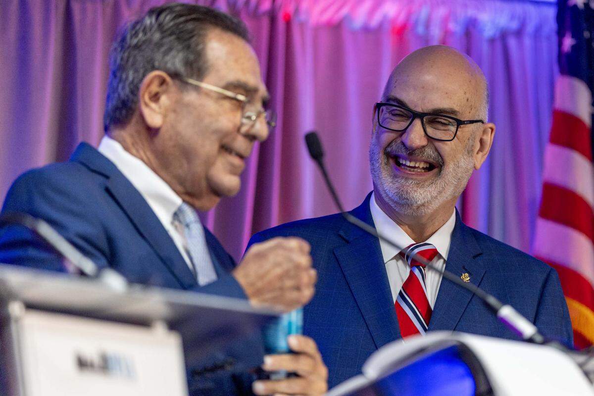 Former City Manager Emilio T. Gonzalez interacts with former Mayor Xavier Suarez during a City of Miami mayoral debate hosted by the Downtown Neighbors Alliance at Hyatt Regency Miami on Tuesday, September 30, 2025, in Miami, Fla. Other candidates in attendance included Miami Commissioner Joe Carollo, former Commissioner Alex Díaz de la Portilla, former Miami-Dade Commissioner Eileen Higgins and former Commissioner Ken Russell.