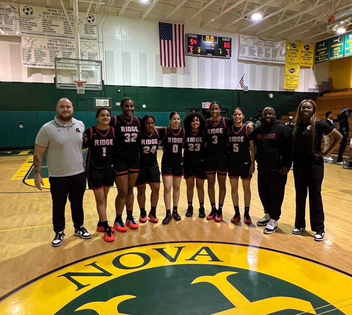 Miami Southridge’s girls’ basketball team celebrates after beating Davie Nova on Friday in the Region 4-6A final to advance to state for the first time since 1987.