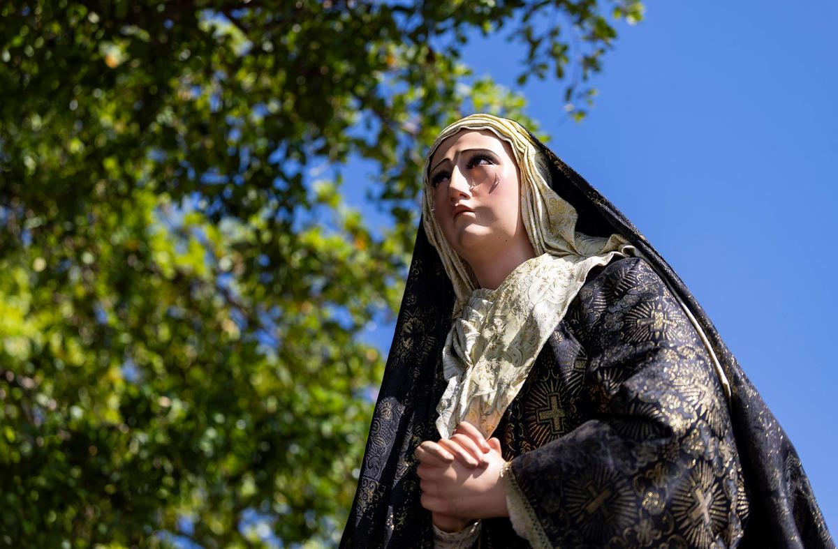 A statue of the Virgin Mary is carried during a Living Stations of the Cross procession near the Cathedral of St. Mary on Friday, April 18, 2025, in Miami, Fla.